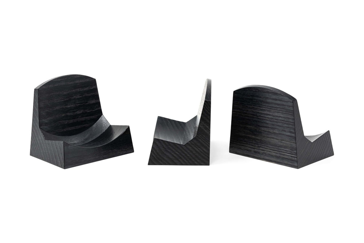 Black wooden display stand for barometers or clocks, shown from three angles