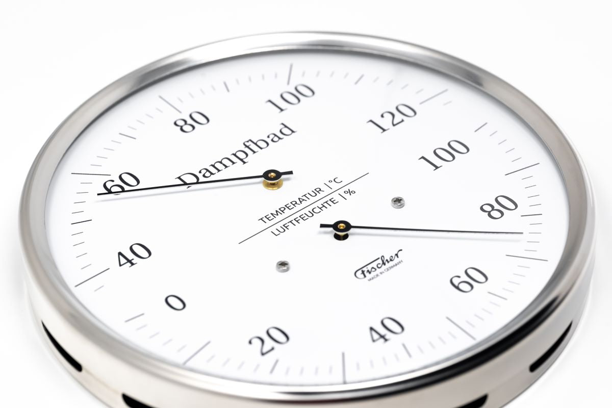 German-made sauna thermometer and hygrometer with white dial and steel frame