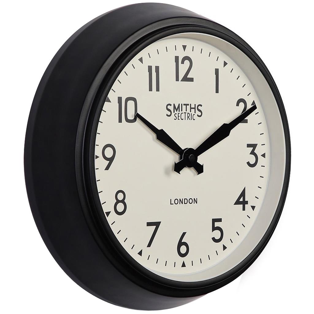 Black round wall clock with white face, bold numerals, and classic design
