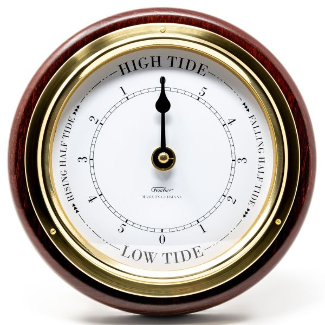 Round analog tide clock with white face, gold trim, and wood frame indicating high and low tide.