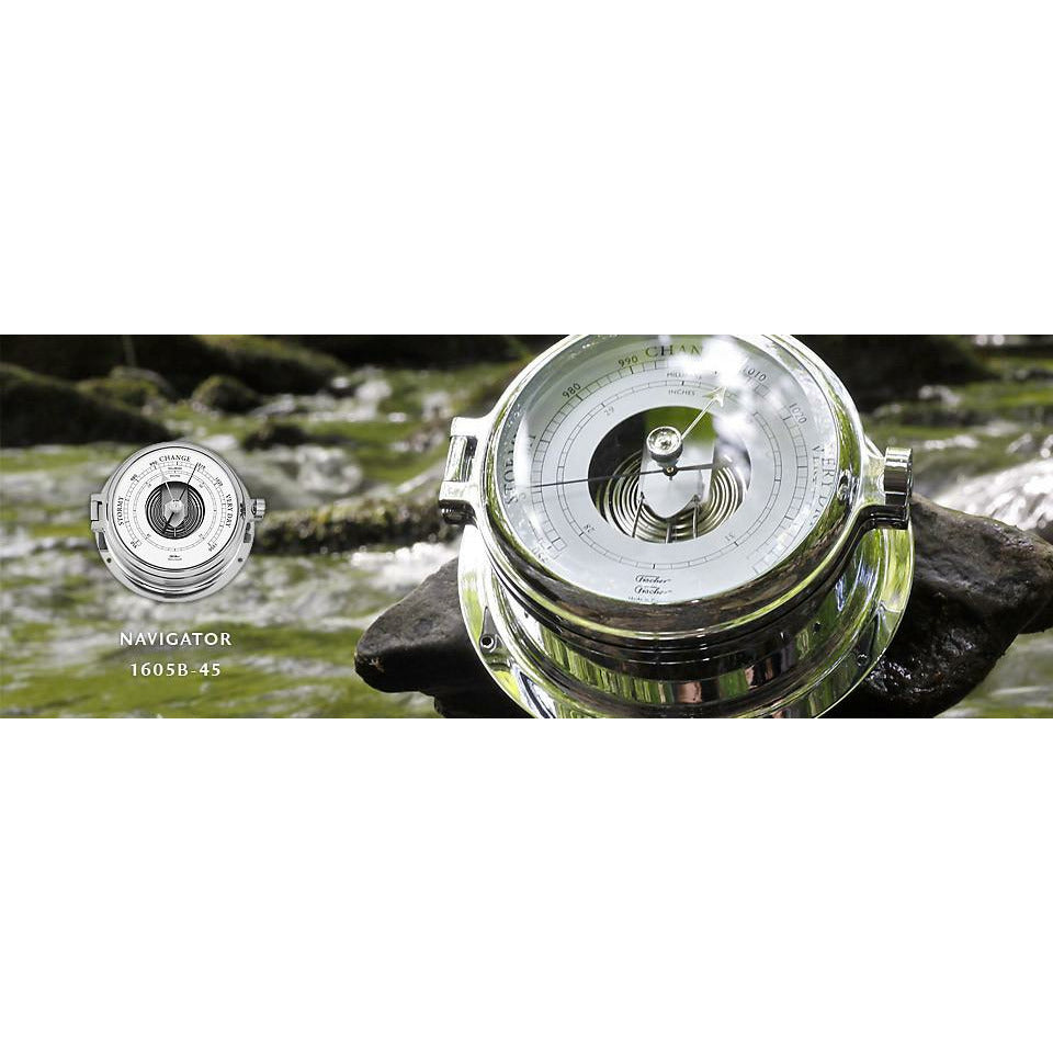 Chrome nautical barometer Navigator 1605B-45 on a rock with a stream background