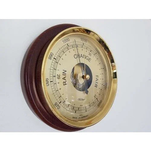 German wall barometer with brass bezel and wooden base for weather measurement