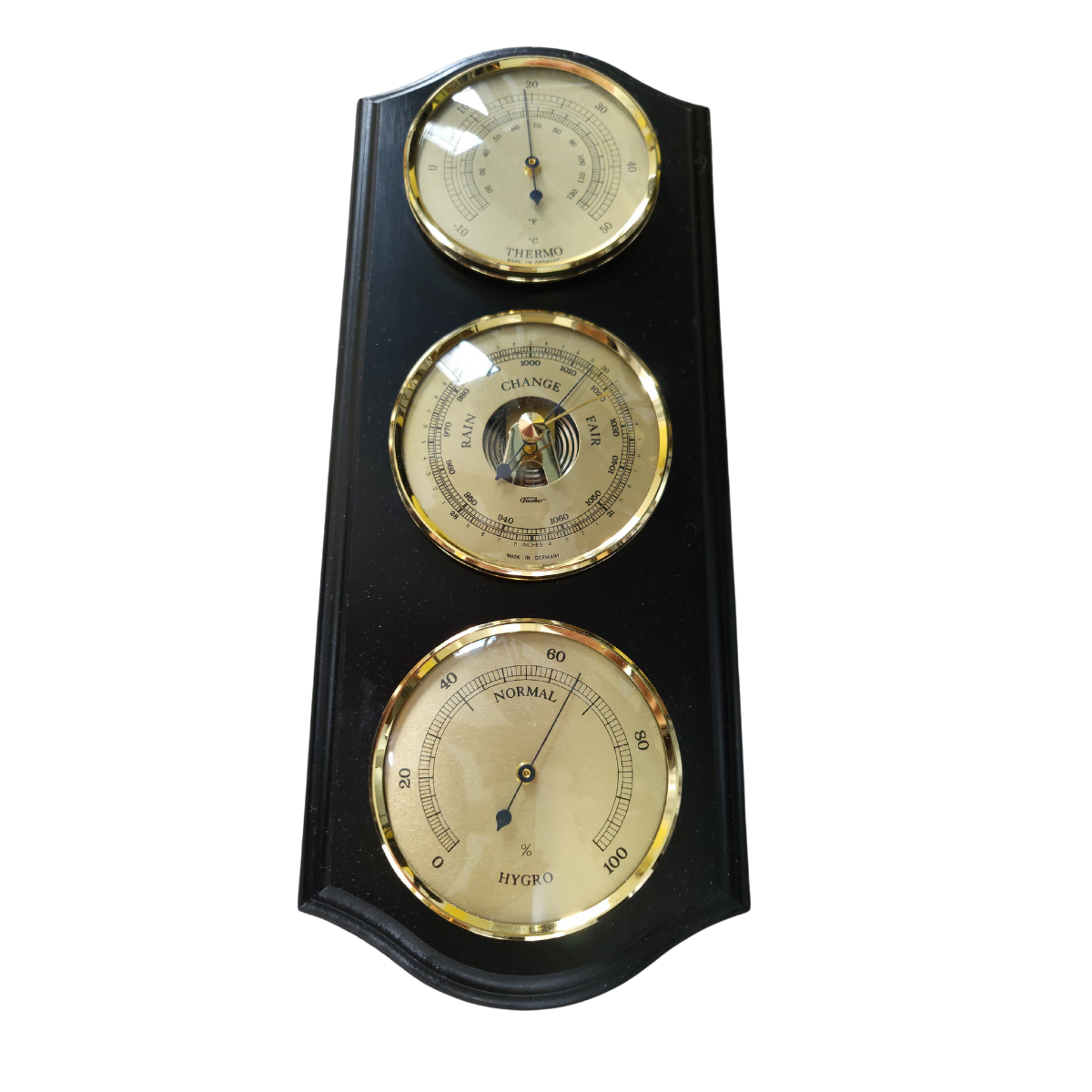 Wall-mounted weather station with barometer, thermometer, and hygrometer dials