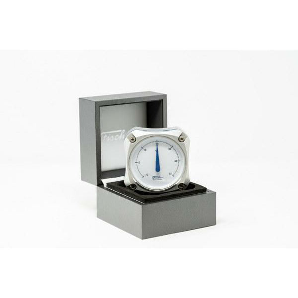 Modern desktop barometer in a gray presentation box, minimalist weather instrument
