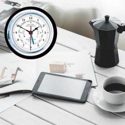 German made analog barometer and clock on white desk with coffee, tablet, and papers