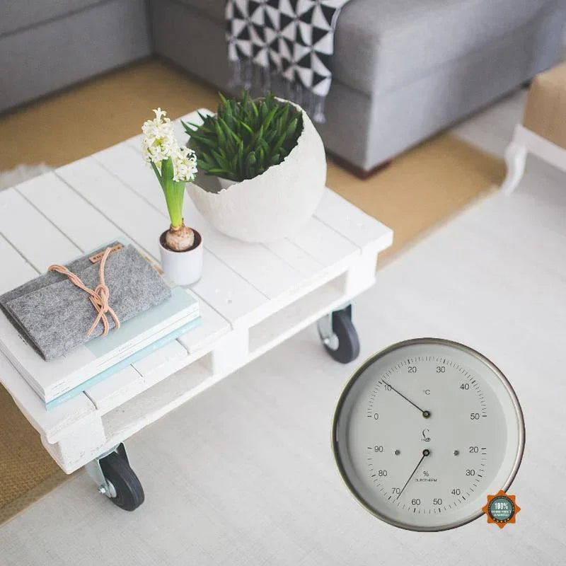 German hygrometer and thermometer on white coffee table in modern living room