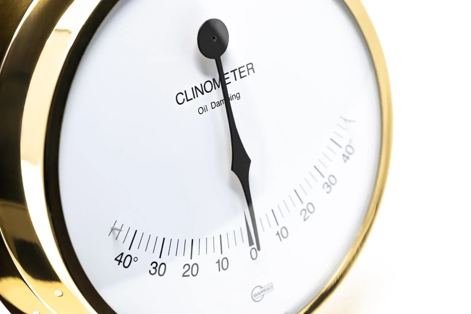Brass clinometer with oil damping, nautical instrument showing tilt angle scale.
