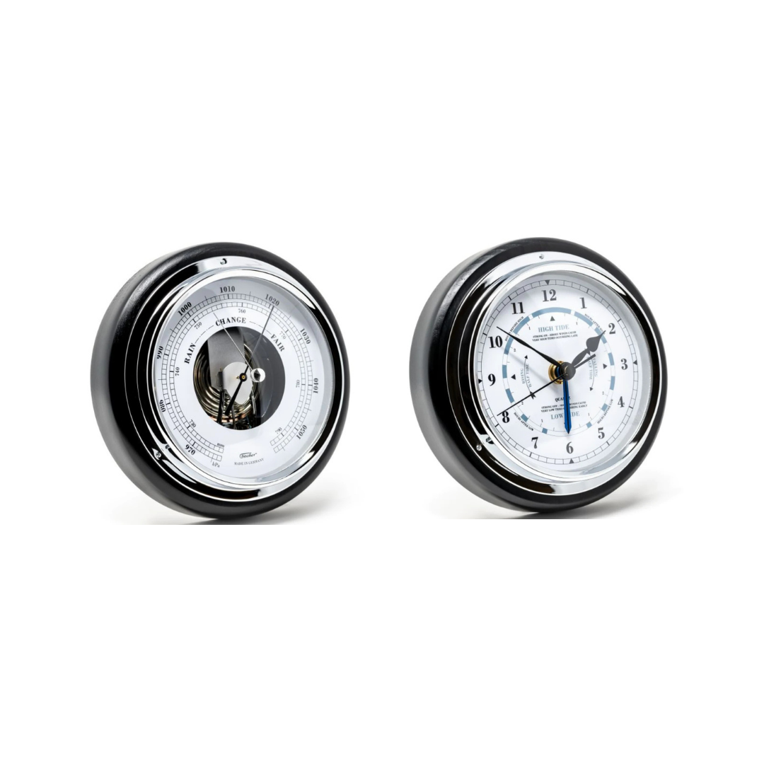 Black rim German barometer and tide clock set with white dials on white background